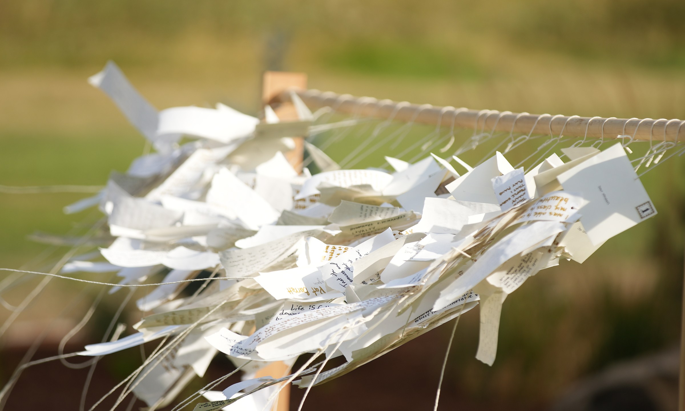 Hand written notes mourners wrote at the Vandal Healing Garden and Memorial dedication ceremony on Aug. 21, 2024.