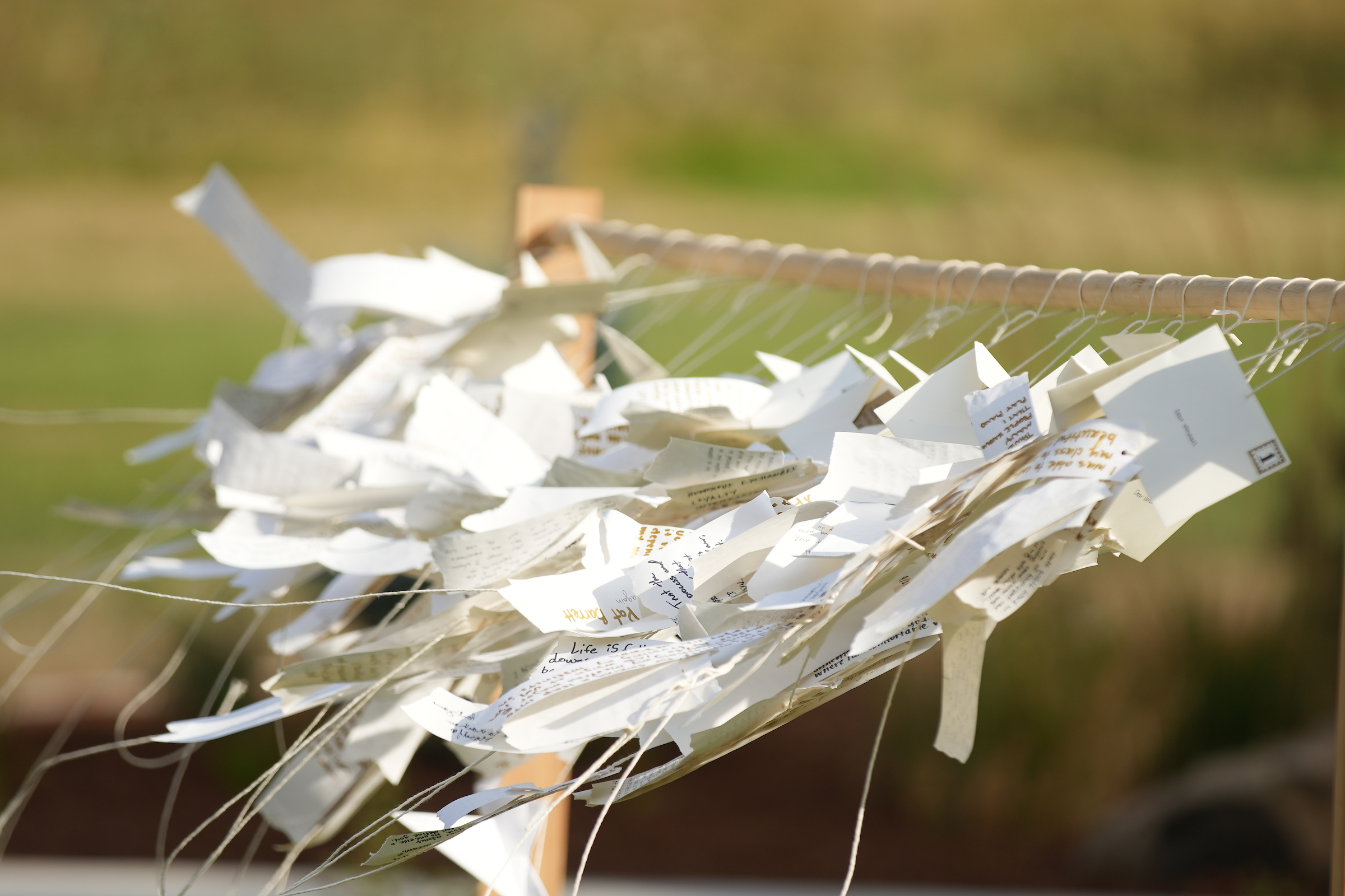 Hand written notes mourners wrote at the Vandal Healing Garden and Memorial dedication ceremony on Aug. 21, 2024.