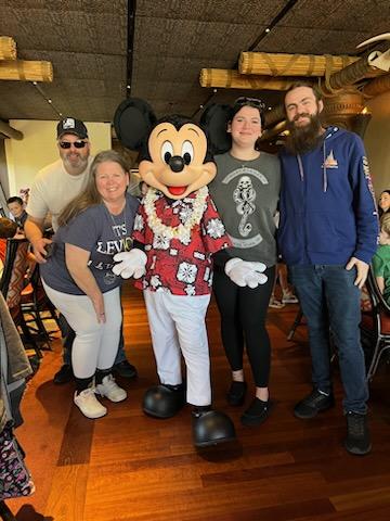 A family with Mickey Mouse