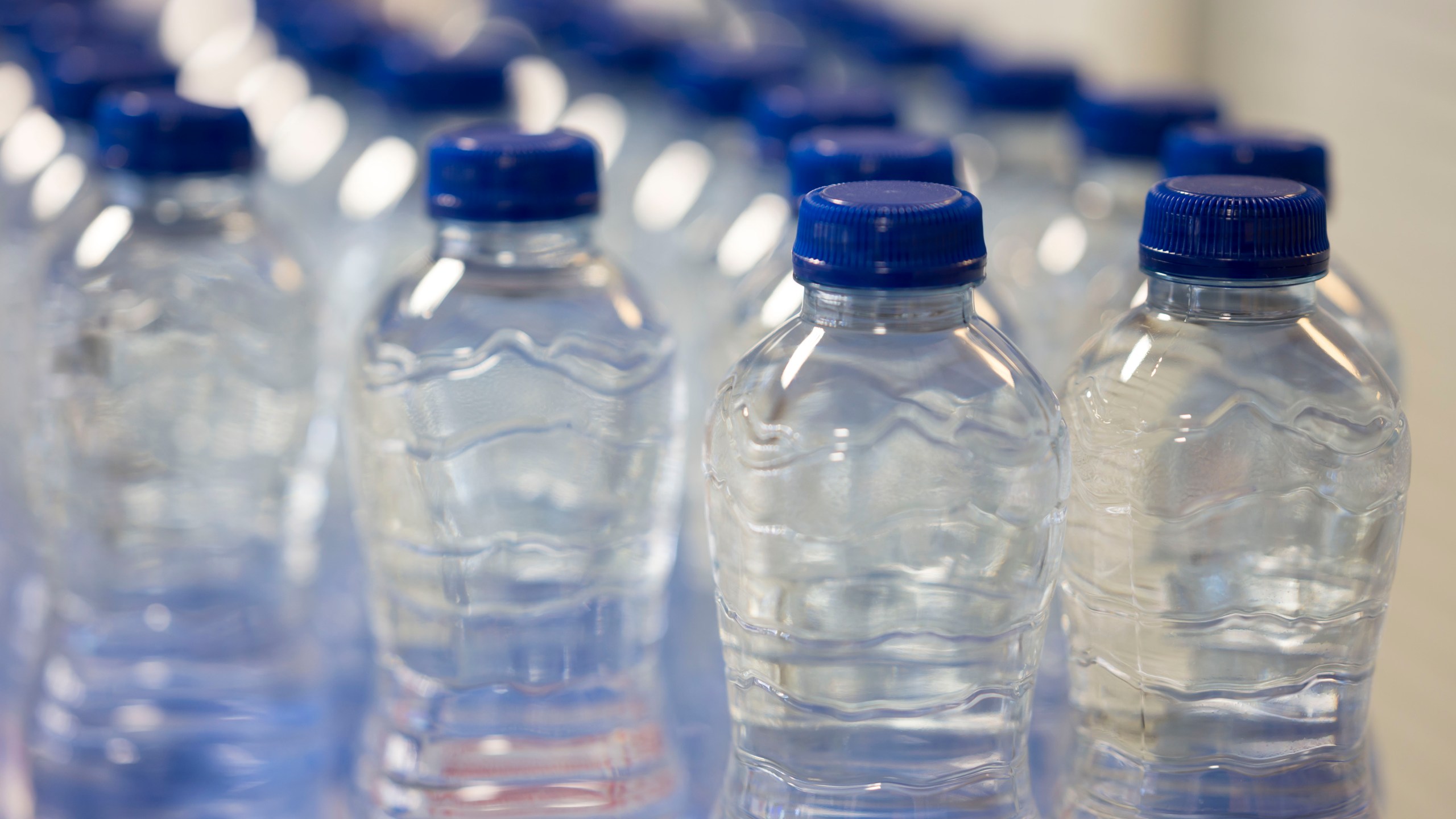 A close-up of plastic water bottles