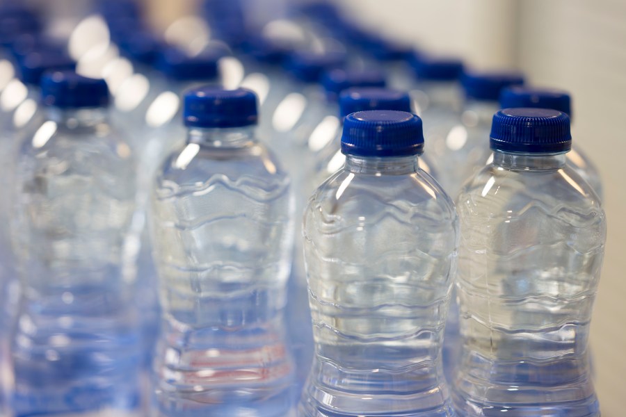 A close-up of plastic water bottles