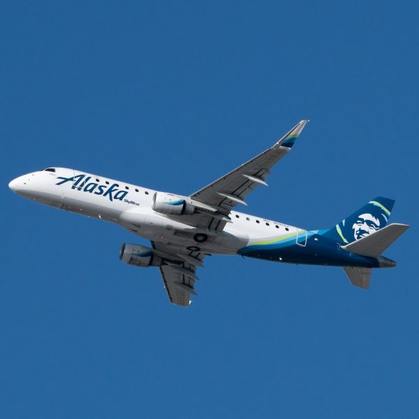 Alaska SkyWest Embraer E175LR takes off from Los Angeles international Airport.