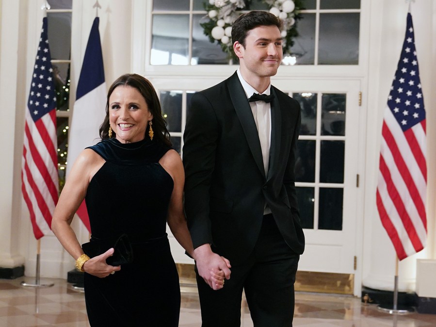 Actress Julia Louis-Dreyfus and her son Charlie Hall arrive for the White House state dinner for French President Emmanuel Macron at the White House on December 1, 2022.