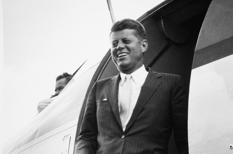 John F. Kennedy stands near helicopter in Columbia, South Carolina, in the 1960s.