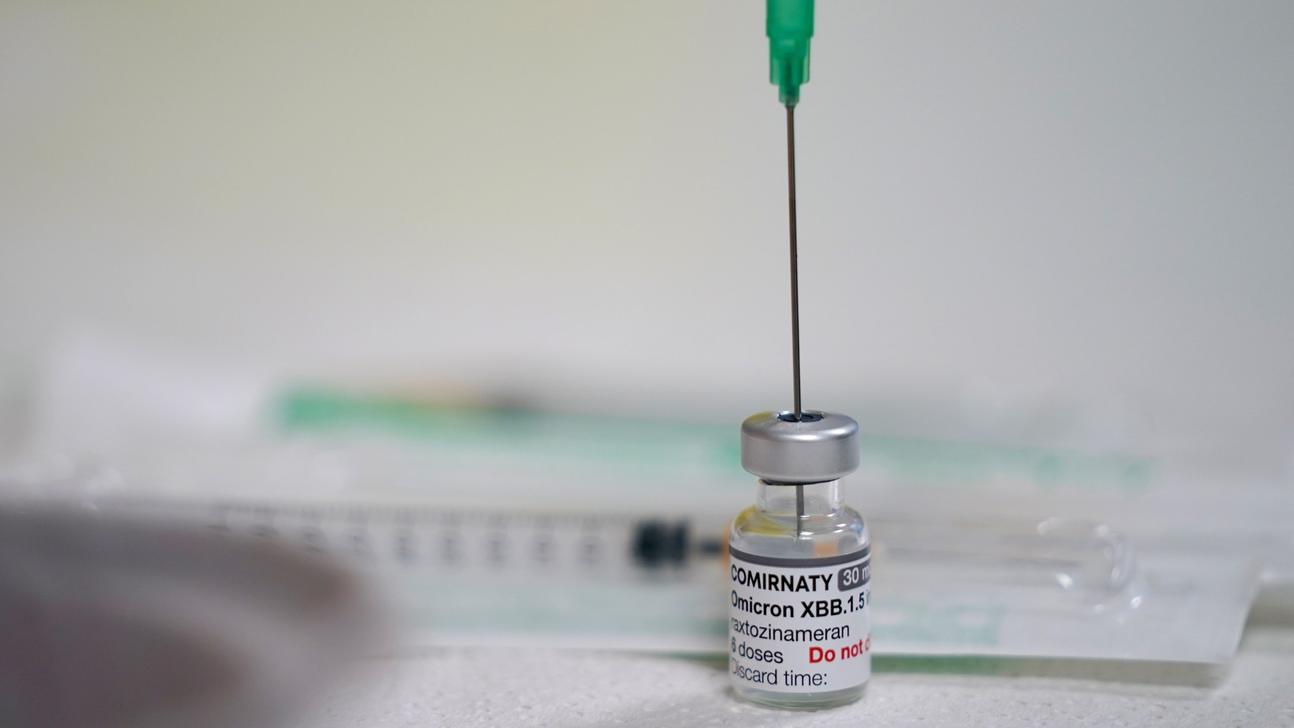 An employee prepares a coronavirus vaccination