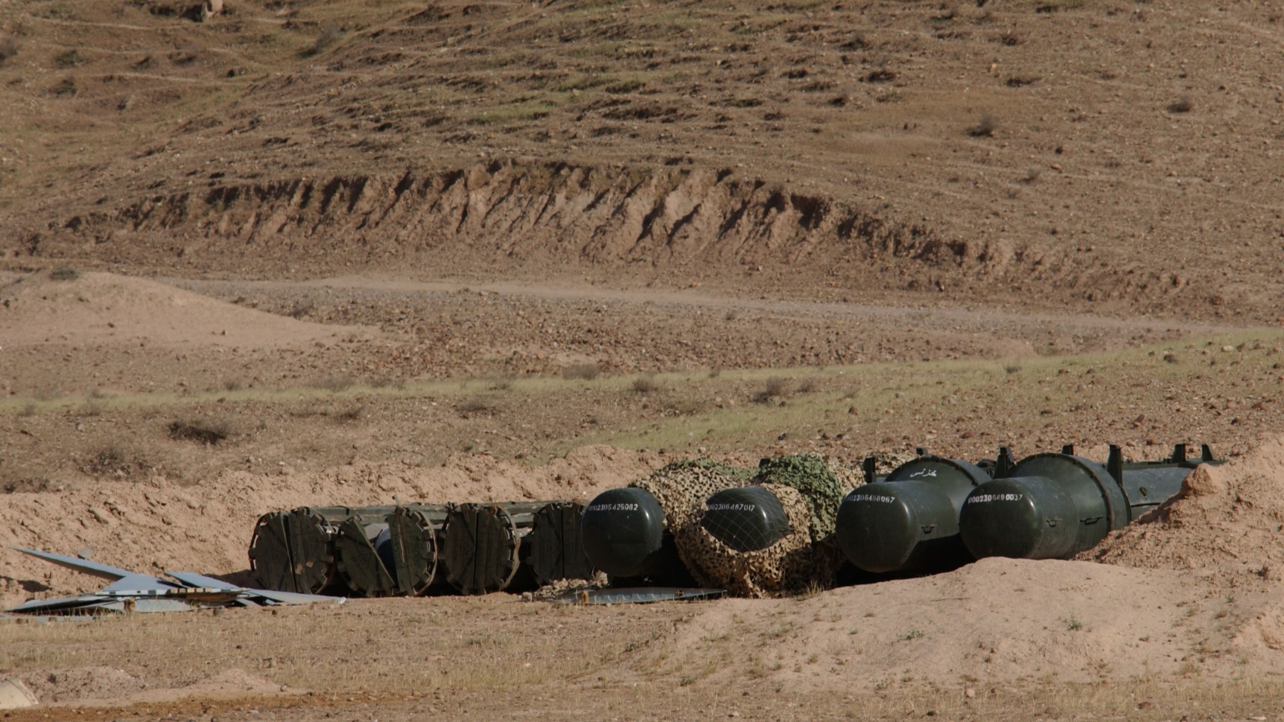 Containers holding high explosives sit at a site suspected of housing chemical weapons April 28th, 2003 in Iraq.