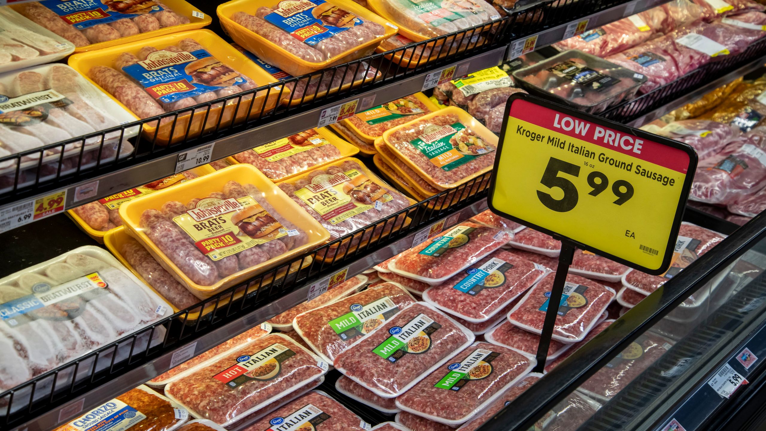 Sausage at a meat counter inside a Fred Meyer grocery store.