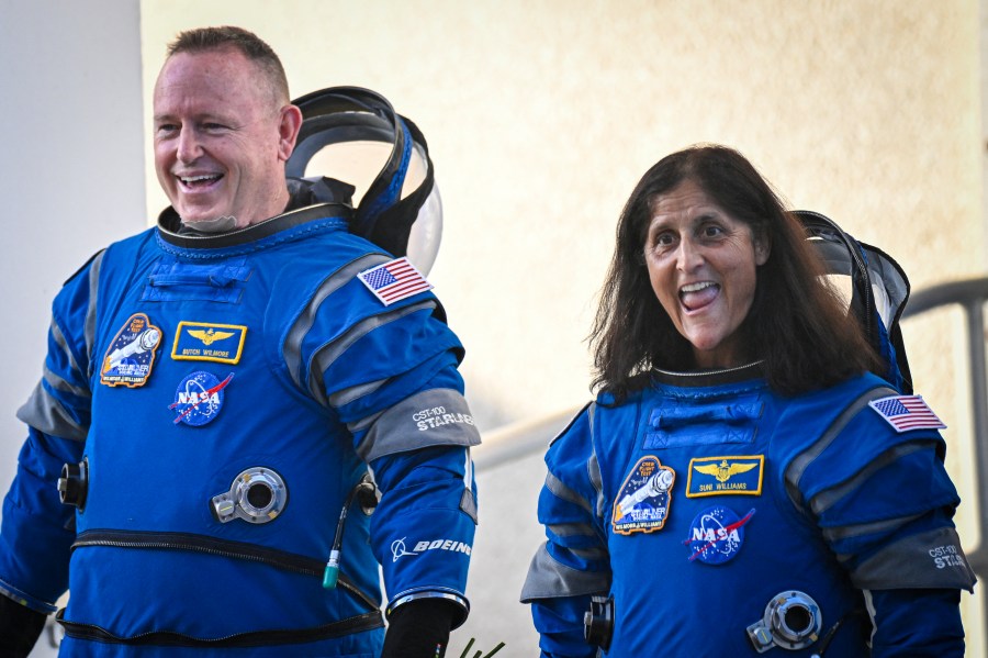 NASA astronauts Butch Wilmore (R) and Suni Williams, wearing Boeing spacesuits.