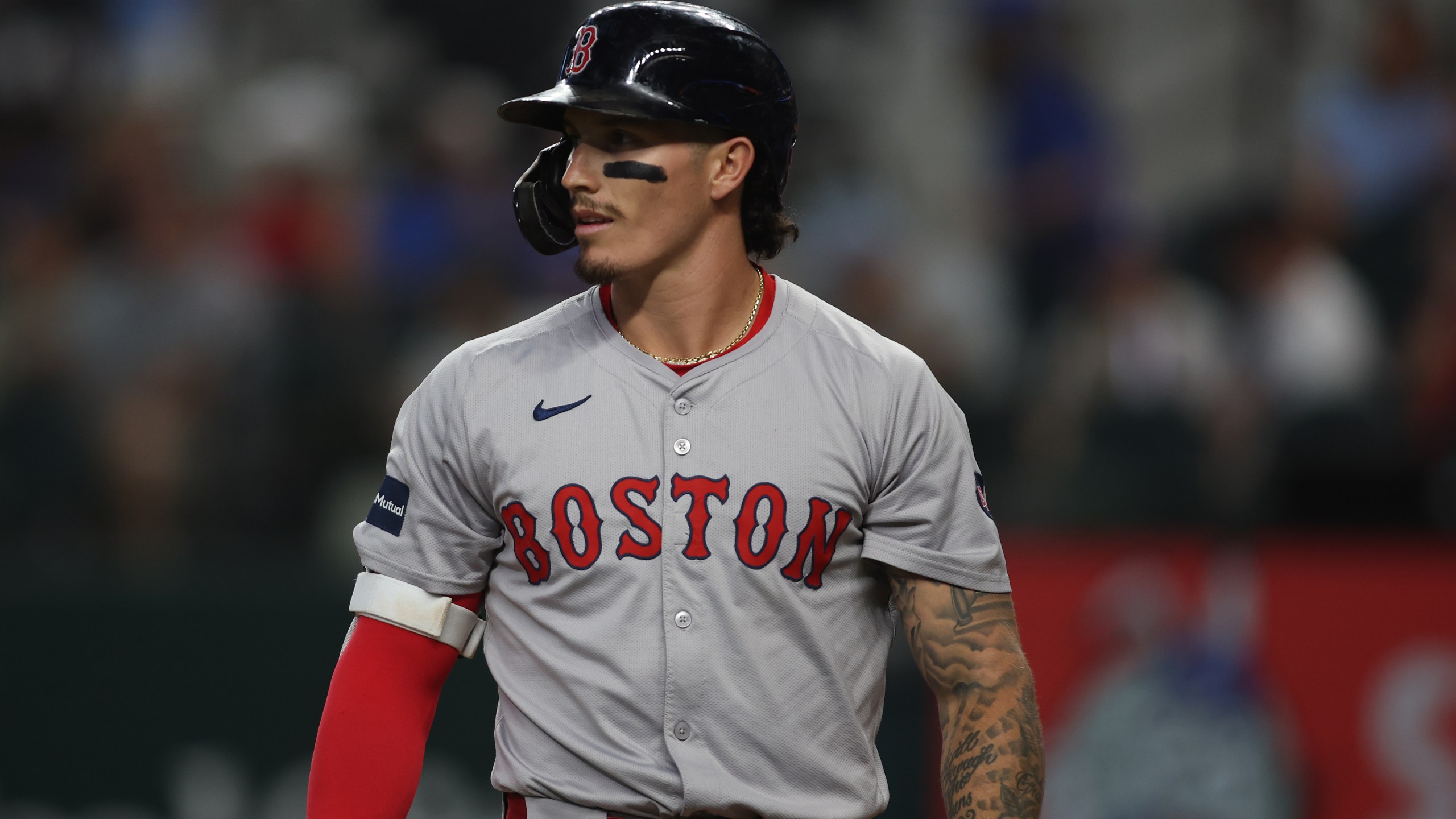 Jarren Duran #16 of the Boston Red Sox walks off the field in the game against the Texas Rangers