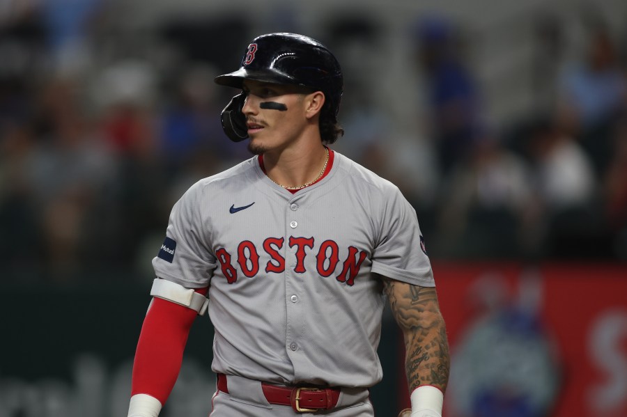 Jarren Duran #16 of the Boston Red Sox walks off the field in the game against the Texas Rangers