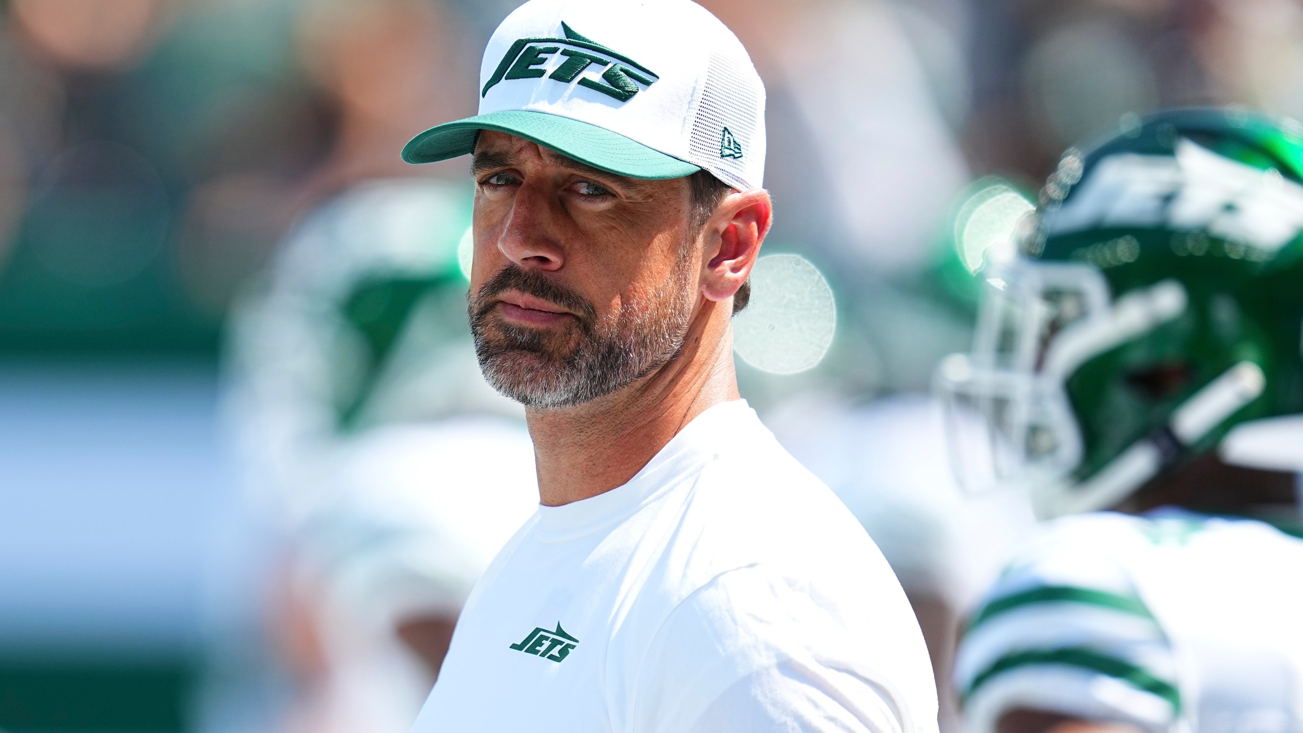 Aaron Rodgers watches as the Jets take on the Commanders in the 2024 NFL preseason