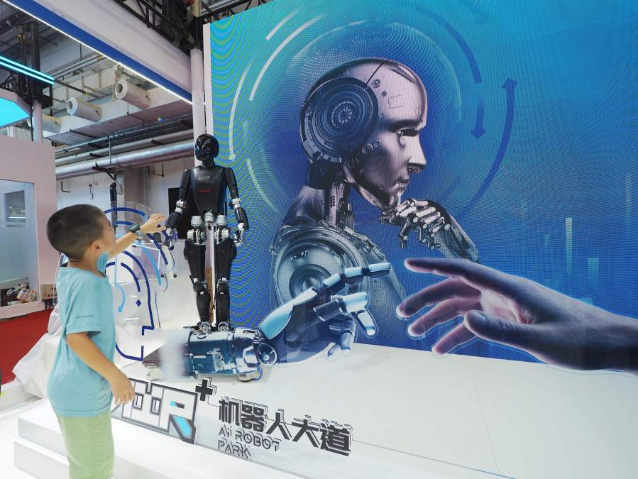 Visitors view a ''humanoid robot'' at the 2024 World Robot Conference in Beijing, China, on August 22, 2024.