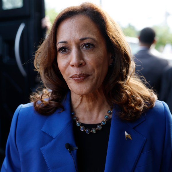 Kamala Harris speaks to reporters.