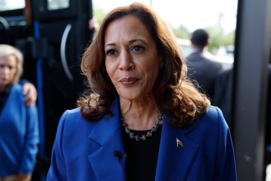 Kamala Harris speaks to reporters.