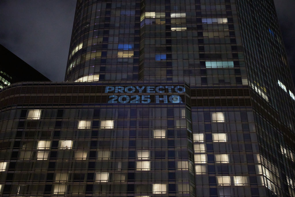 "Project 2025 HQ" projected onto the outside of the Trump Hotel before the Democratic National Convention in Chicago.