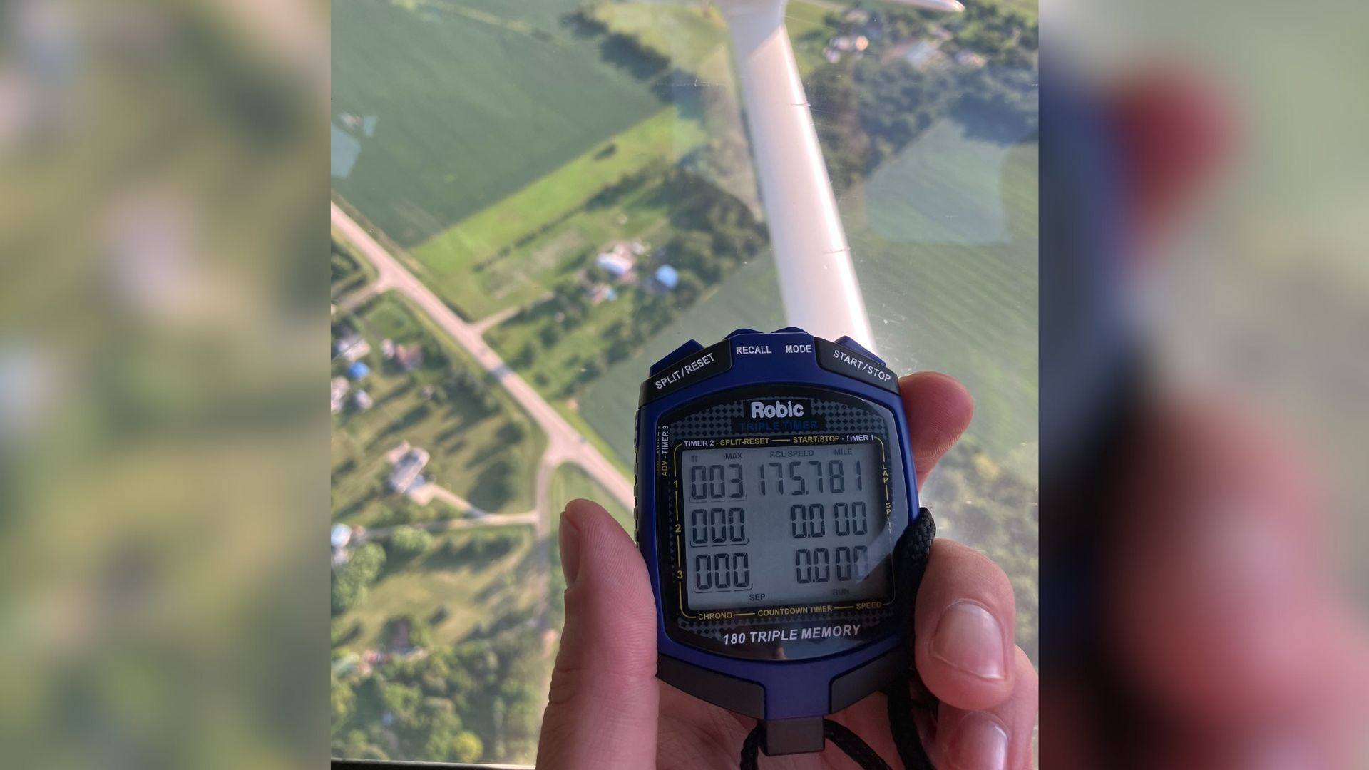 Wisconsin State Patrol officer holds a speed timer displaying 175 mph