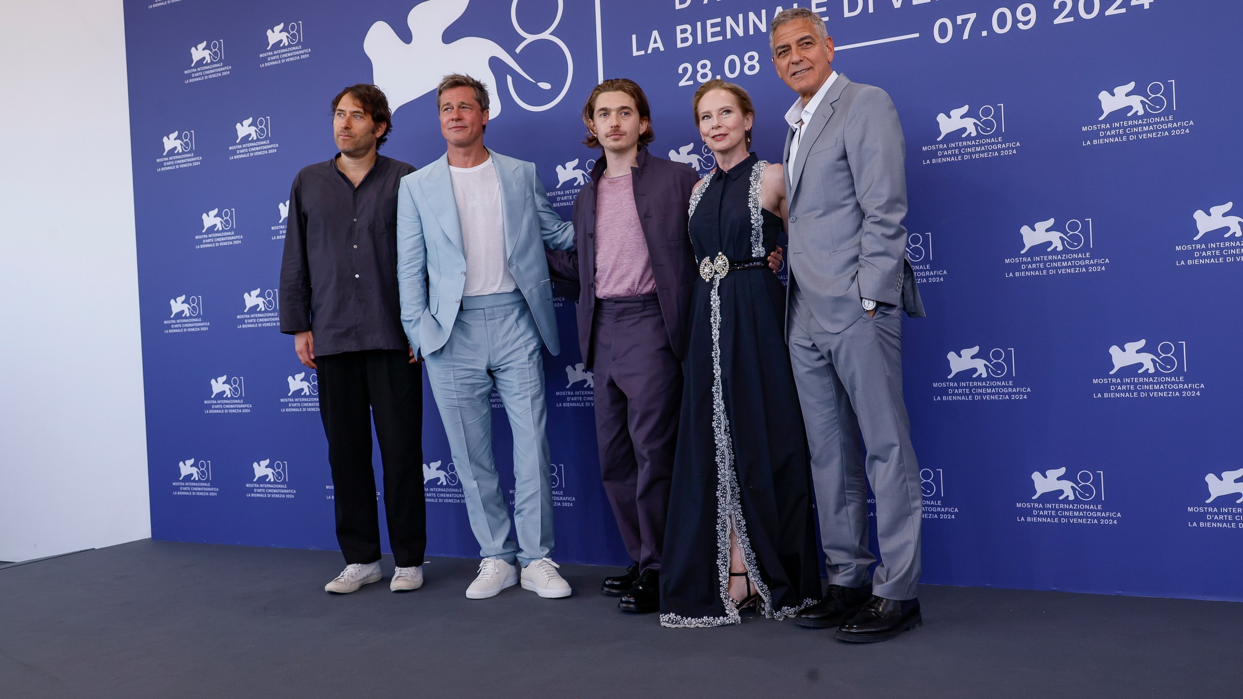 Director Jon Watts, from left, Brad Pitt, Austin Abrams, Amy Ryan and George Clooney pose for photographers at the photo call for the film 'Wolfs' during the 81st edition of the Venice Film Festival in Venice, Italy, on Sunday, Sept. 1, 2024. (Photo by Joel C Ryan/Invision/AP)