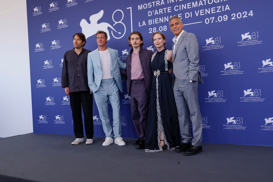 Director Jon Watts, from left, Brad Pitt, Austin Abrams, Amy Ryan and George Clooney pose for photographers at the photo call for the film 'Wolfs' during the 81st edition of the Venice Film Festival in Venice, Italy, on Sunday, Sept. 1, 2024. (Photo by Joel C Ryan/Invision/AP)