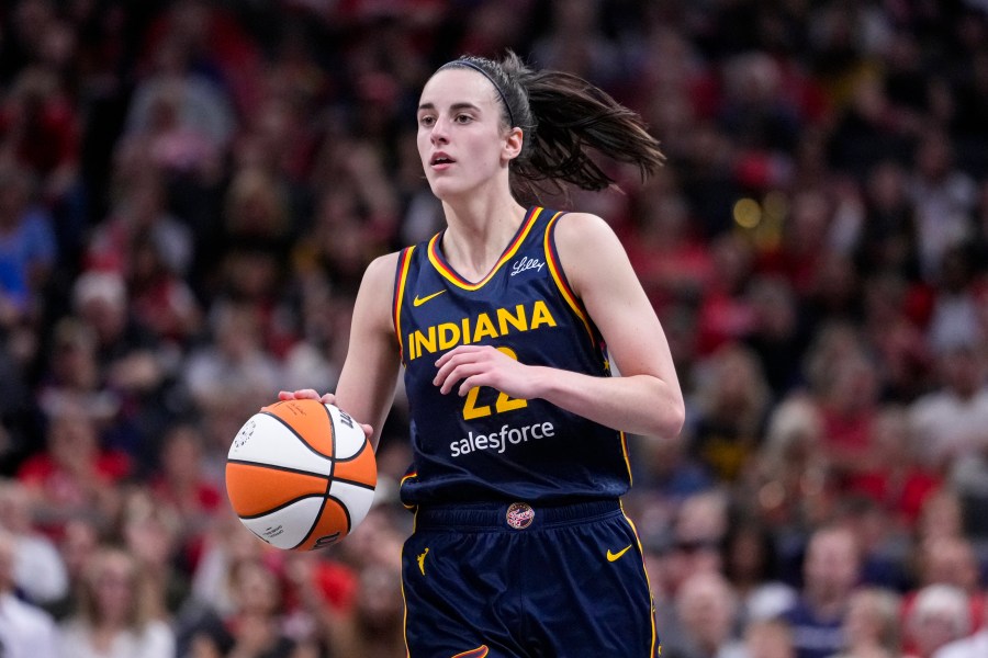 Indiana Fever guard Caitlin Clark (22) plays against the Los Angeles Sparks in the second half of a WNBA basketball game in Indianapolis, Wednesday, Sept. 4, 2024. (AP Photo/Michael Conroy)