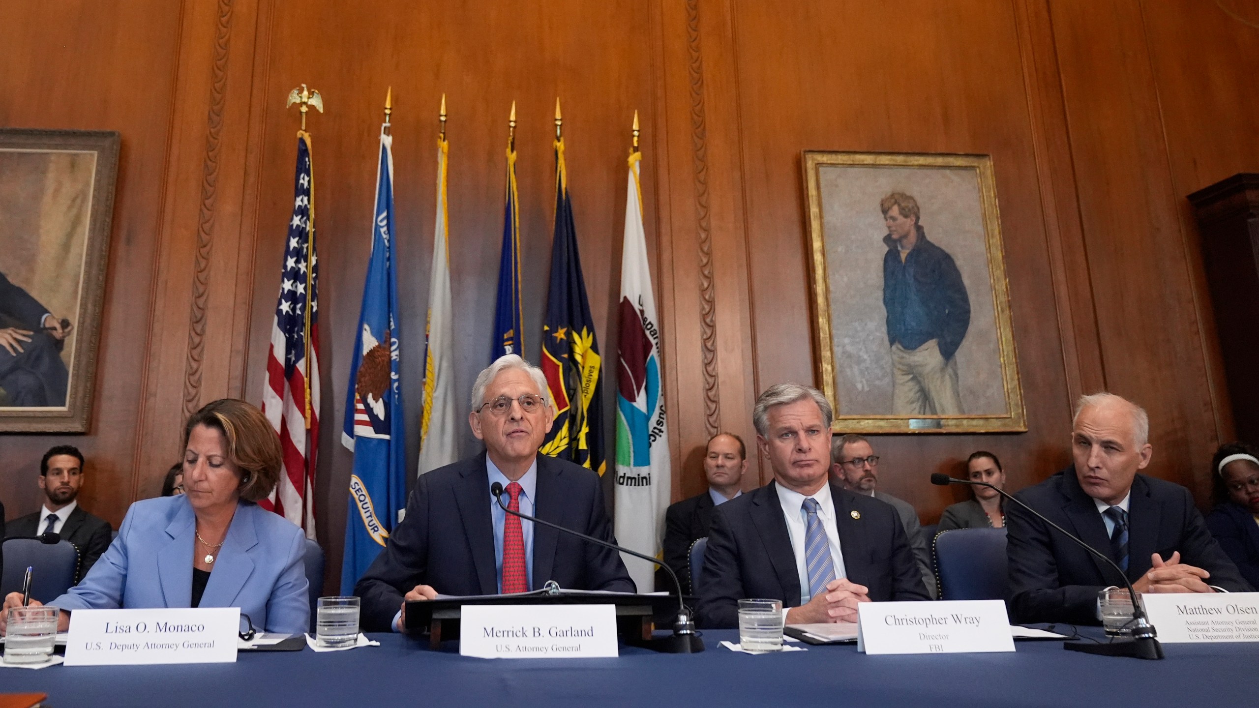 Attorney General Merrick Garland speaks before a meeting of the Justice Department's Election Threats Task Force, at the Department of Justice, Wednesday, Sept. 4, 2024, in Washington, with Deputy Attorney General Lisa Monaco, left, FBI Director Christopher Wray, center right, and Assistant Attorney General, National Security Division, Matthew Olsen, right. (AP Photo/Mark Schiefelbein)