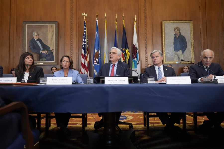 Attorney General Merrick Garland, center, speaks before a meeting of the Justice Department's Election Threats Task Force, at the Department of Justice, Wednesday, Sept. 4, 2024, in Washington, with from left, Deputy Attorney General, Criminal Division, Nicole Argentieri, Deputy Attorney General Lisa Monaco, Garland, FBI Director Christopher Wray and Assistant Attorney General, National Security Division, Matthew Olsen. (AP Photo/Mark Schiefelbein)