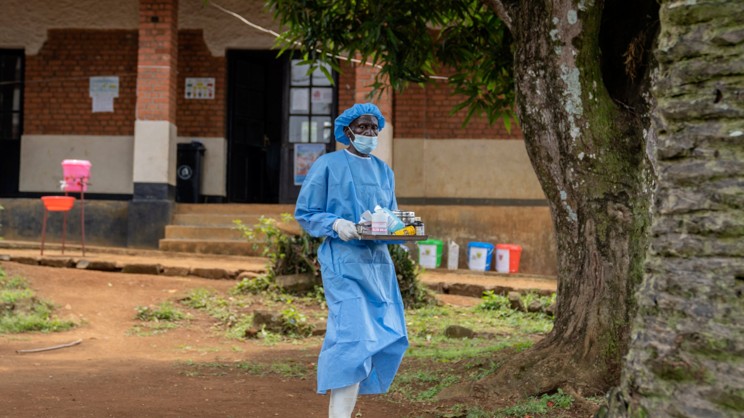 A health worker carries medication to be giving to a man suffering for mpox at the Kamituga General Hospital in South Kivu Congo, Wednesday, Sept. 4, 2024. (AP Photo/Moses Sawasawa)