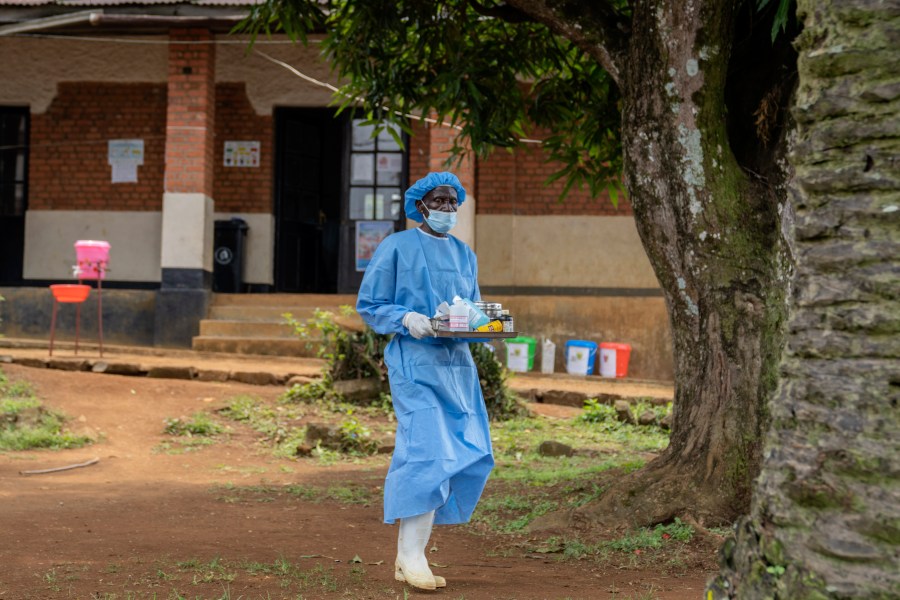 A health worker carries medication to be giving to a man suffering for mpox at the Kamituga General Hospital in South Kivu Congo, Wednesday, Sept. 4, 2024. (AP Photo/Moses Sawasawa)