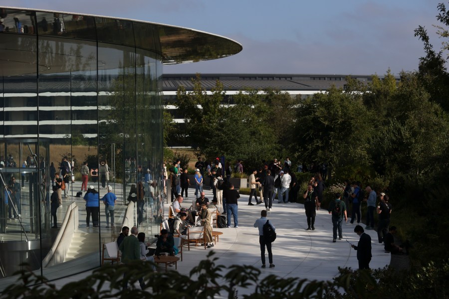 Attendees wait inside and outside the Steve Jobs Theater before an announcement of new products at Apple headquarters Monday, Sept. 9, 2024, in Cupertino, Calif. (AP Photo/Juliana Yamada)