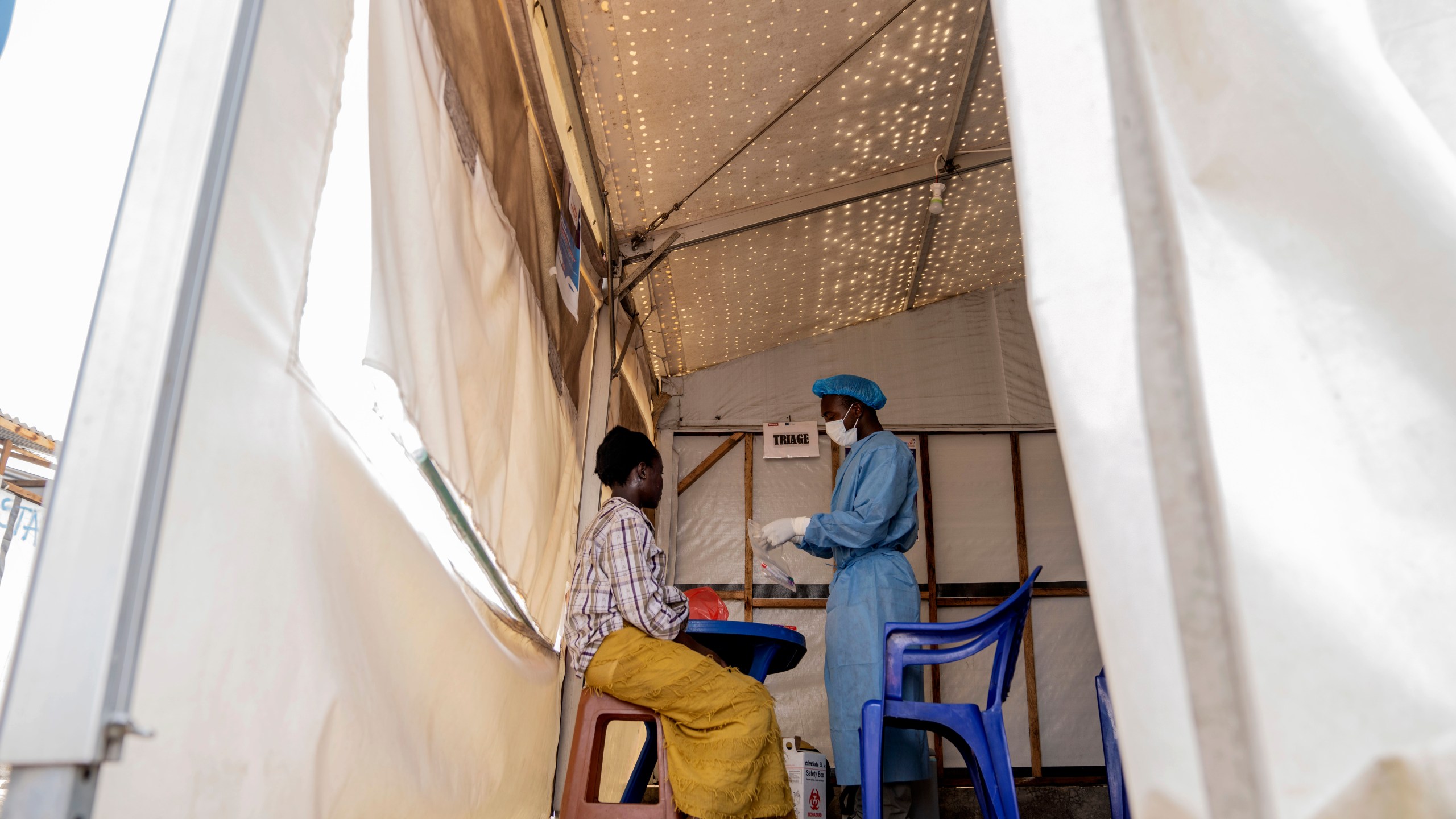 FILE - A health worker attends to a mpox patient, at a treatment centre in Munigi, eastern Congo, Monday, Aug. 19, 2024. (AP Photo/Moses Sawasawa, File)