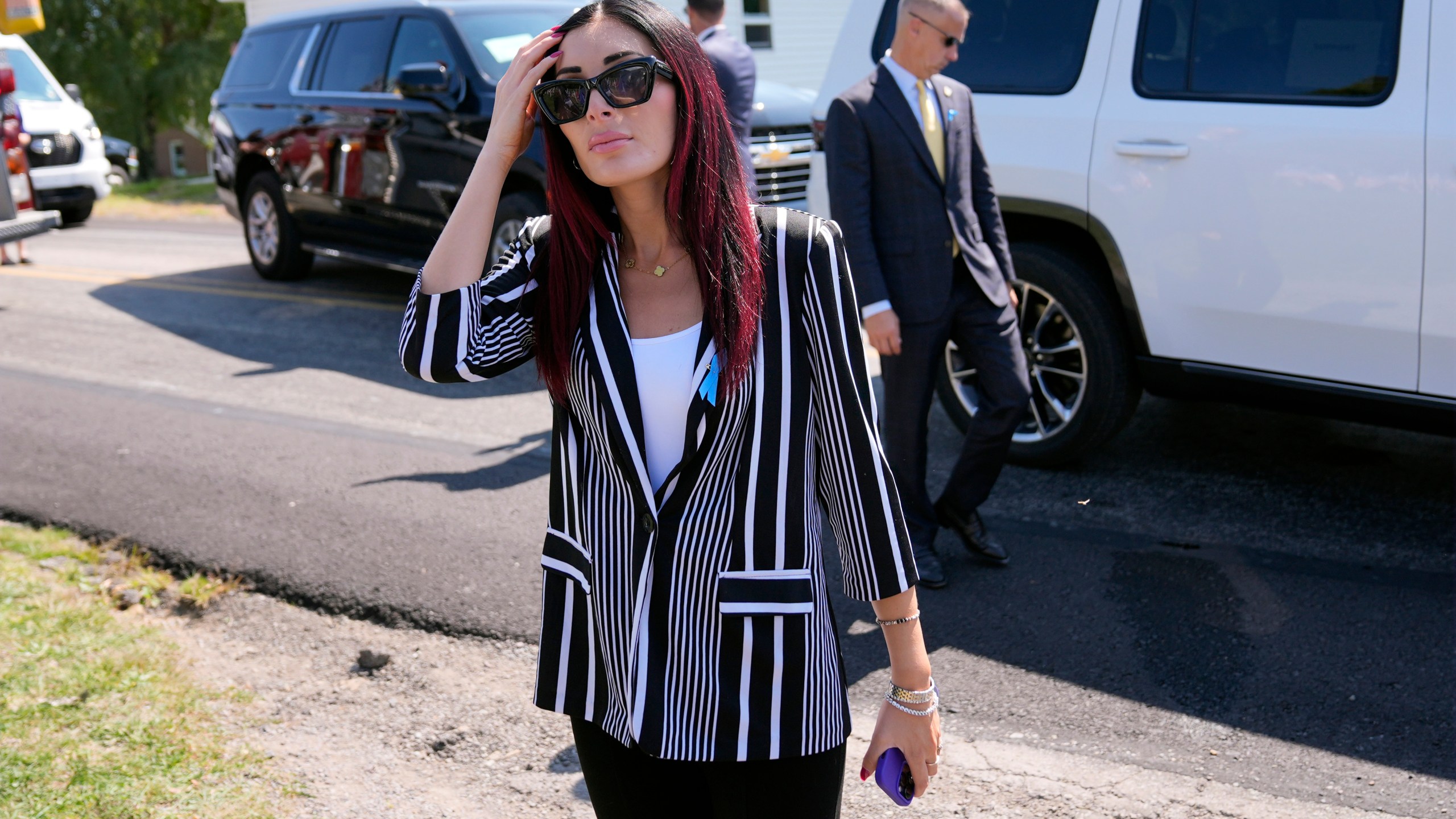 Laura Loomer arrives with Republican presidential nominee former President Donald Trump for a visit to the Shanksville Volunteer Fire Company in Shanksville, Pa., Wednesday, Sept. 11, 2024. (AP Photo/Matt Rourke)