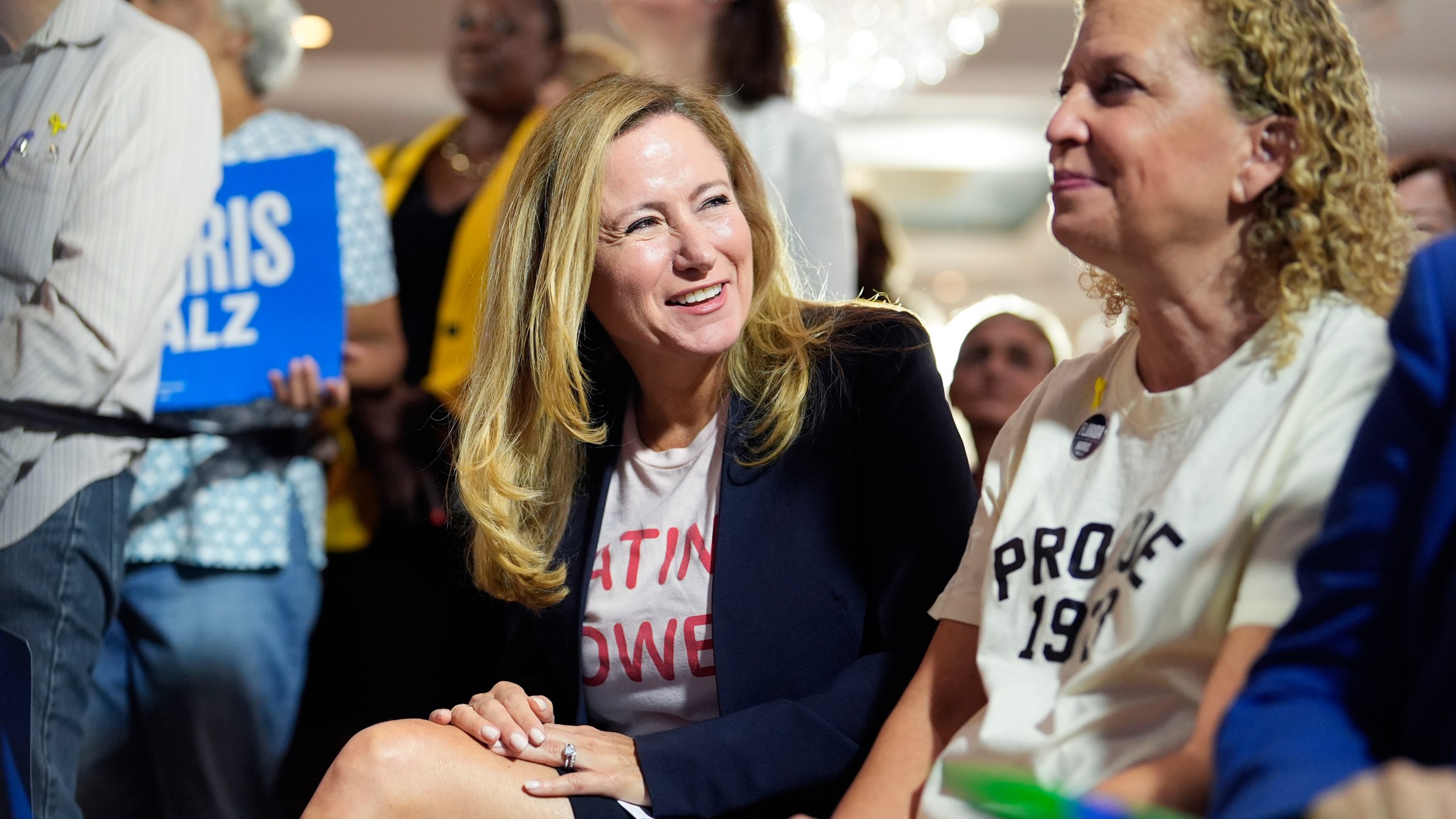 FILE - Former Rep. Debbie Mucarsel-Powell of Florida, center, now a Democratic candidate for the U.S. Senate, center, and Rep. Debbie Wasserman Schultz of Florida, right, help kick off a national "Reproductive Freedom Bus Tour" by the campaign of Democratic presidential nominee Vice President Kamala Harris and running mate Gov. Tim Walz, Tuesday, Sept. 3, 2024, in Boynton Beach, Fla. (AP Photo/Rebecca Blackwell, File)