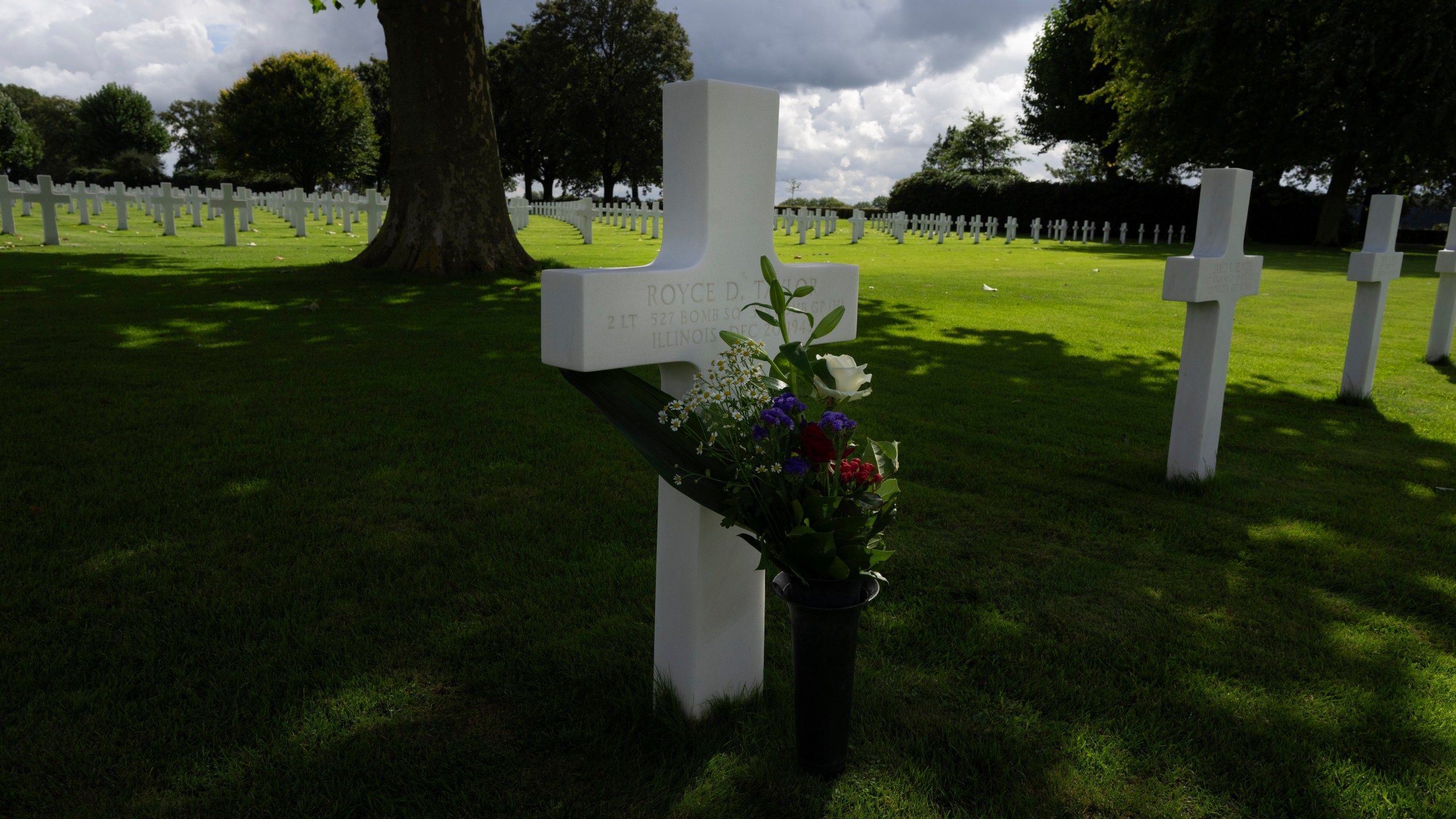 Eighty years after the liberation of the south of the Netherlands the grave of Second Lt. Royce Taylor, a bombardier with the 527 Bomb Squadron, center, stands among the 8,288 crosses and Star of David headstones at the Netherlands American Cemetery in Margraten, southern Netherlands, on Wednesday, Sept. 11, 2024. (AP Photo/Peter Dejong)