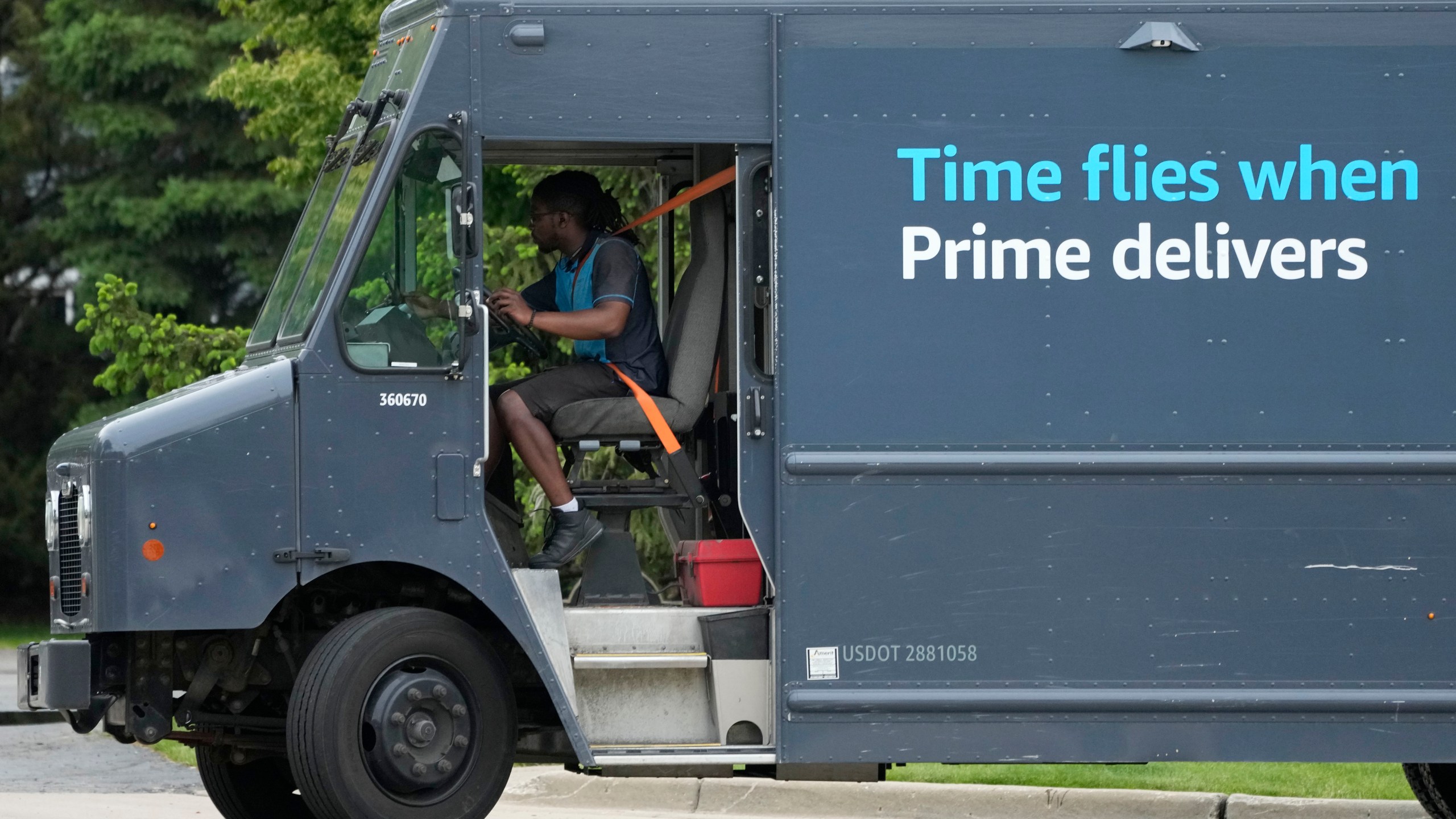 FILE - An Amazon truck makes deliveries in Wheeling, Ill., May 16, 2024. (AP Photo/Nam Y. Huh, File)