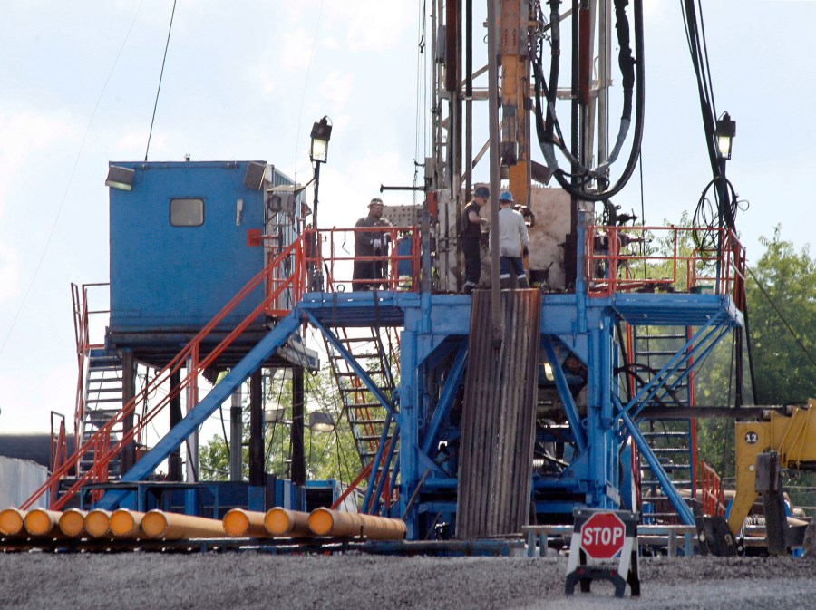 FILE - A crew works on a gas drilling rig at a well site for shale based natural gas in Zelienople, Pa. June 25, 2012. (AP Photo/Keith Srakocic, File)