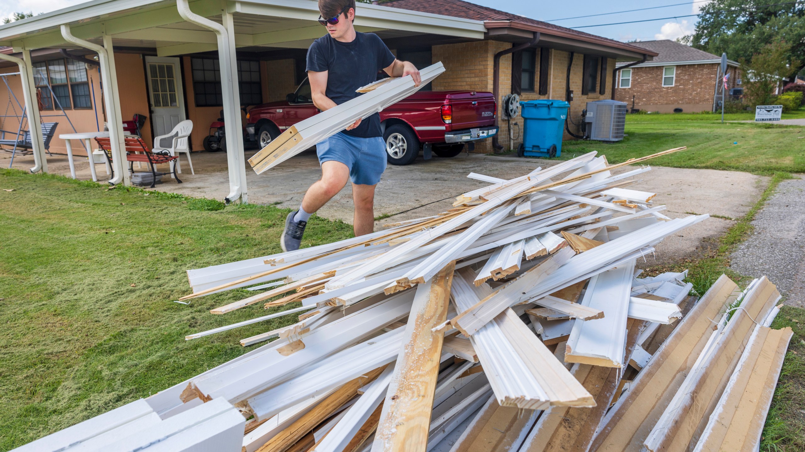 Gavin Hinchman with Precision One Construction Group carefully steps around water-damaged doors and walls as he guts part of a flooded home in Norco, La., on Friday, Sept. 13, 2024, two days after Hurricane Francine swept through the area. (Chris Granger/The Times-Picayune/The New Orleans Advocate via AP)