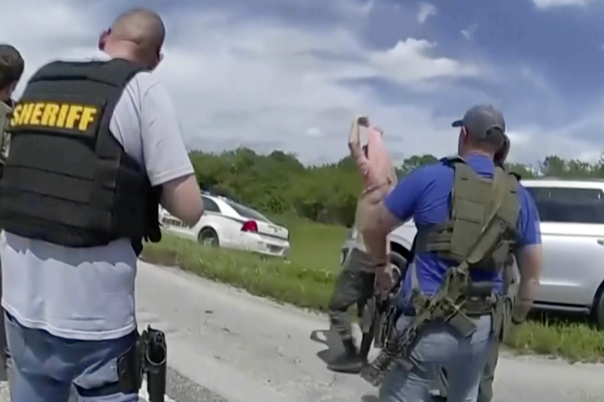 In this image taken from police body camera video and released by the Martin County, Fla., Sheriff’s Office, law enforcement officers prepare to arrest Ryan Routh, the man suspected in the apparent assassination attempt of Donald Trump, Sunday, Sept. 15, 2024. (Martin County Sheriff’s Office via AP)