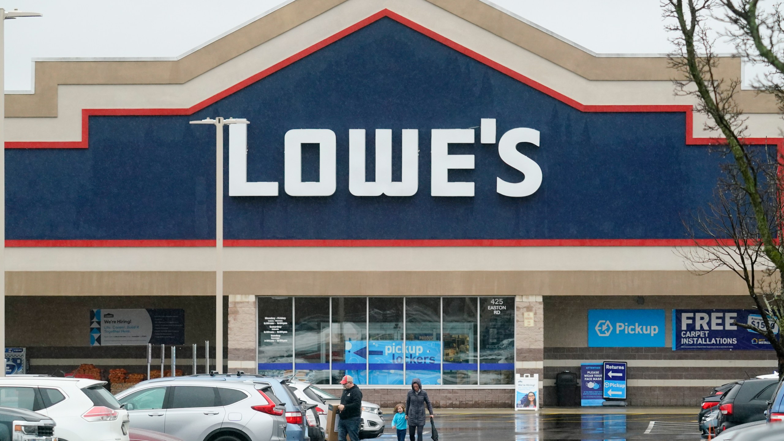 FILE - Shoppers exit a Lowe's in Warrington, Pa., Feb. 4, 2022. (AP Photo/Matt Rourke, File)