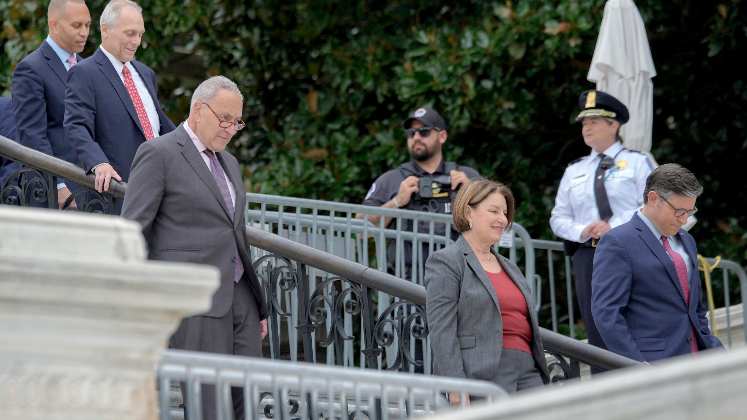 From left, House Minority Leader Hakeem Jeffries, D-N.Y., House Majority Leader Steve Scalise, R-La., Senate Majority Leader Chuck Schumer, D-N.Y., Sen. Amy Klobuchar, D-Minn., and Speaker of the House Mike Johnson, R-La., arrive to the First Nail Ceremony marking the beginning of construction of the 2025 Presidential Inauguration platform, on the steps of the Capitol, Wednesday, Sept. 18, 2024, in Washington. (AP Photo/Mariam Zuhaib)