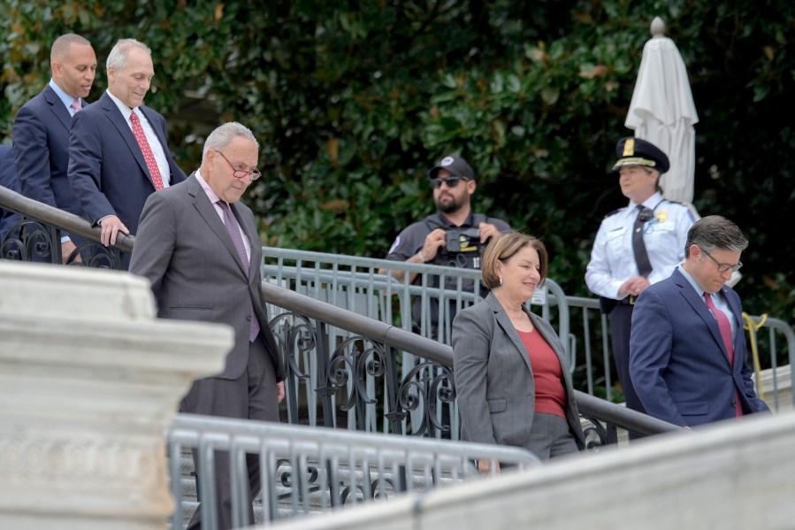 From left, House Minority Leader Hakeem Jeffries, D-N.Y., House Majority Leader Steve Scalise, R-La., Senate Majority Leader Chuck Schumer, D-N.Y., Sen. Amy Klobuchar, D-Minn., and Speaker of the House Mike Johnson, R-La., arrive to the First Nail Ceremony marking the beginning of construction of the 2025 Presidential Inauguration platform, on the steps of the Capitol, Wednesday, Sept. 18, 2024, in Washington. (AP Photo/Mariam Zuhaib)