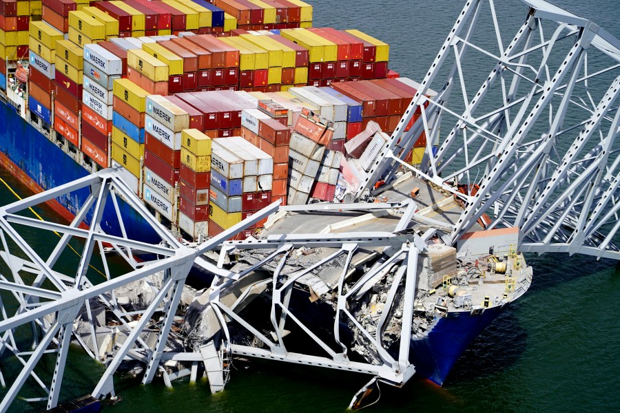 FILE - In this aerial image released by the Maryland National Guard, the cargo ship Dali is stuck under part of the structure of the Francis Scott Key Bridge after the ship hit the bridge, March 26, 2024, in Baltimore. (Maryland National Guard via AP, File)