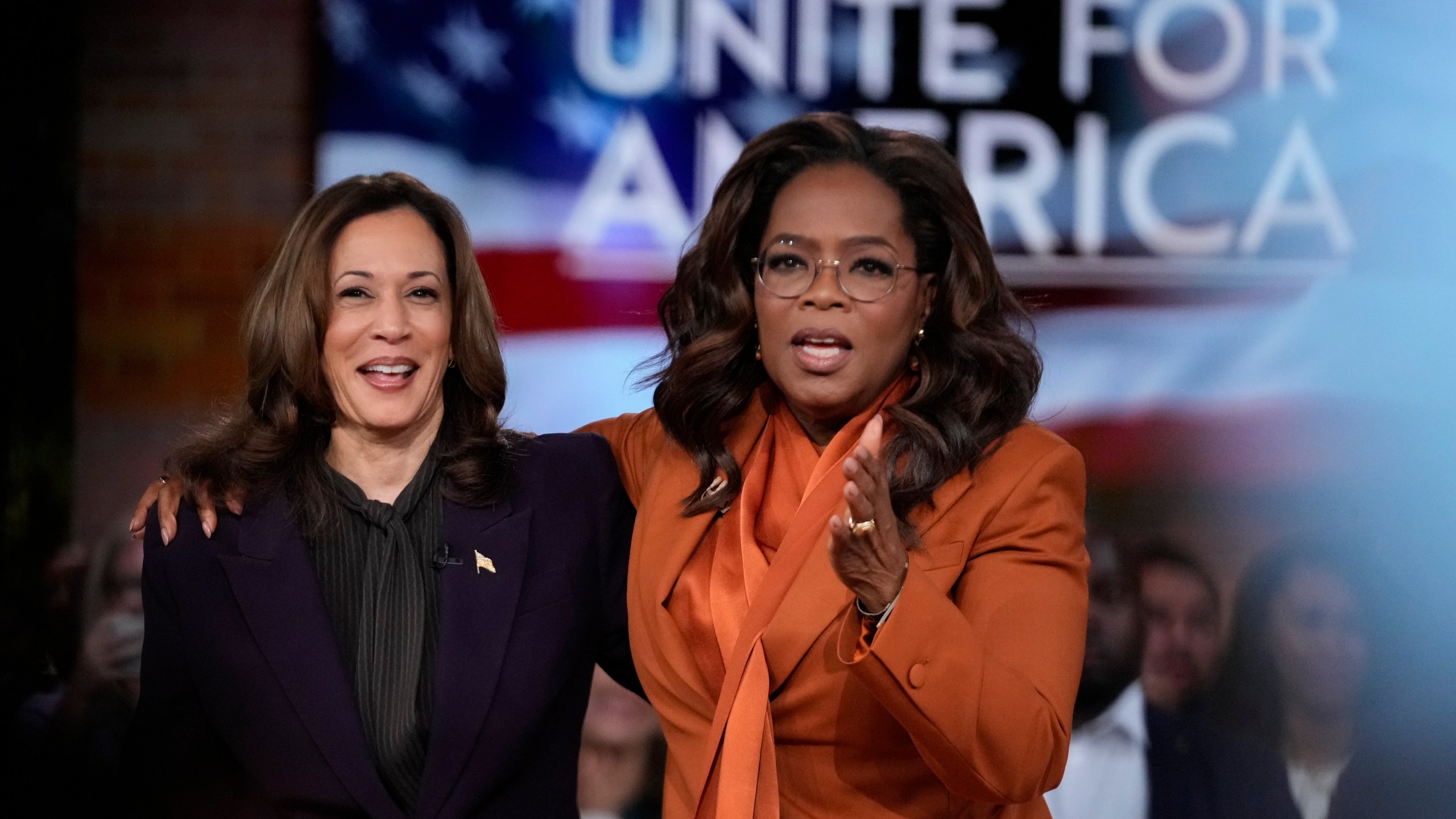 Democratic presidential nominee Vice President Kamala Harris joins Oprah Winfrey at Oprah's Unite for America Live Streaming event Thursday, Sept. 19, 2024 in Farmington Hills, Mich. (AP Photo/Paul Sancya)