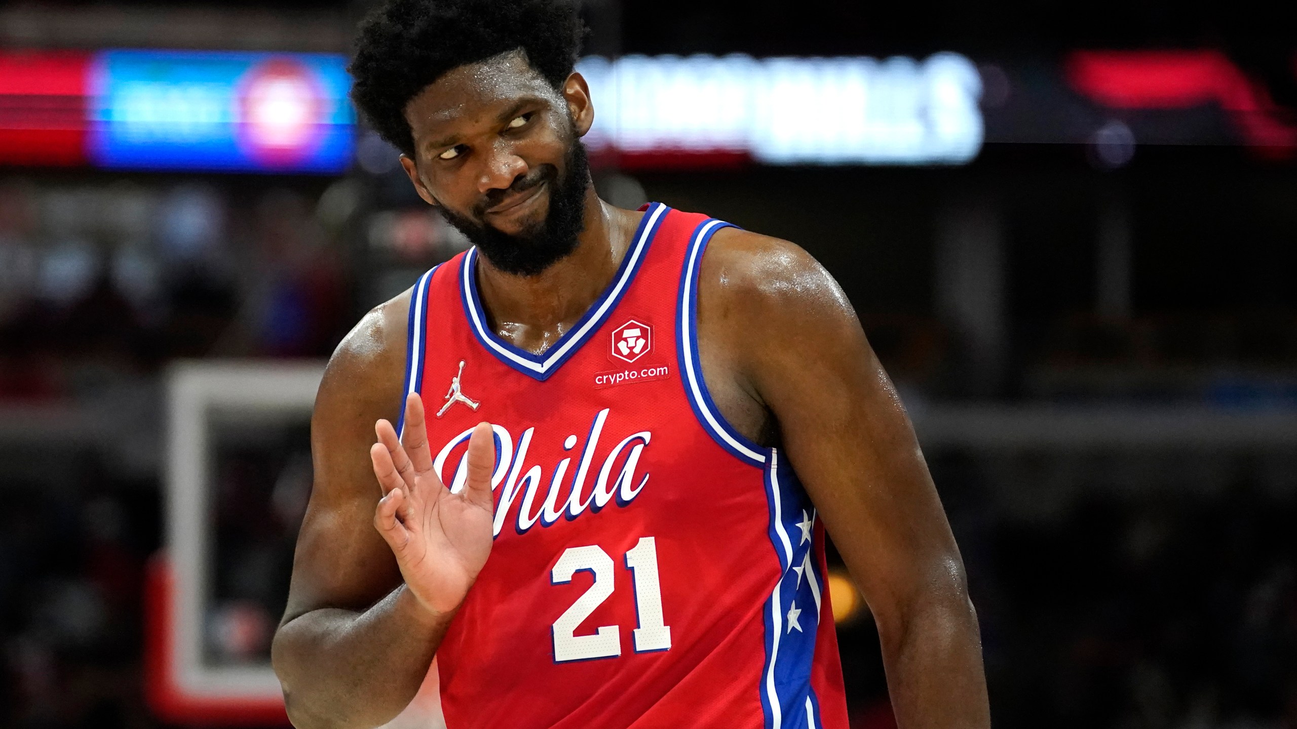 FILE - Philadelphia 76ers' Joel Embiid waves to Chicago Bulls fans after hitting a 3-point shot late in the second half of the team's NBA basketball game against the Bulls of Saturday, Nov. 6, 2021, in Chicago. (AP Photo/Charles Rex Arbogast, File)