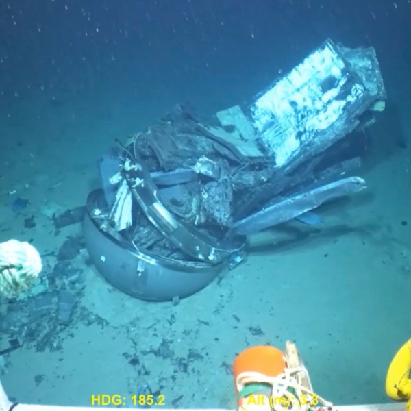 This June 2023 United States Coast Guard still frame from video provided by Pelagic Research Services, shows remains of the Titan submersible, center, on the floor of the Atlantic Ocean. (U.S. Coast Guard Video courtesy Pelagic Research Services via AP)