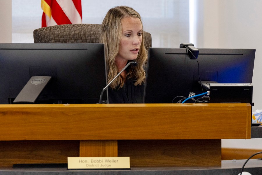 Morton County District Judge Bobbi Weiler recites nine charges, including homicide and possession of foreign substances, on a zoom call during Ian Cramer's plea change hearing at the Morton County Courthouse on Friday, Sept. 20, 2024, in Mandan, N.D. (Tanner Ecker/The Bismarck Tribune via AP)