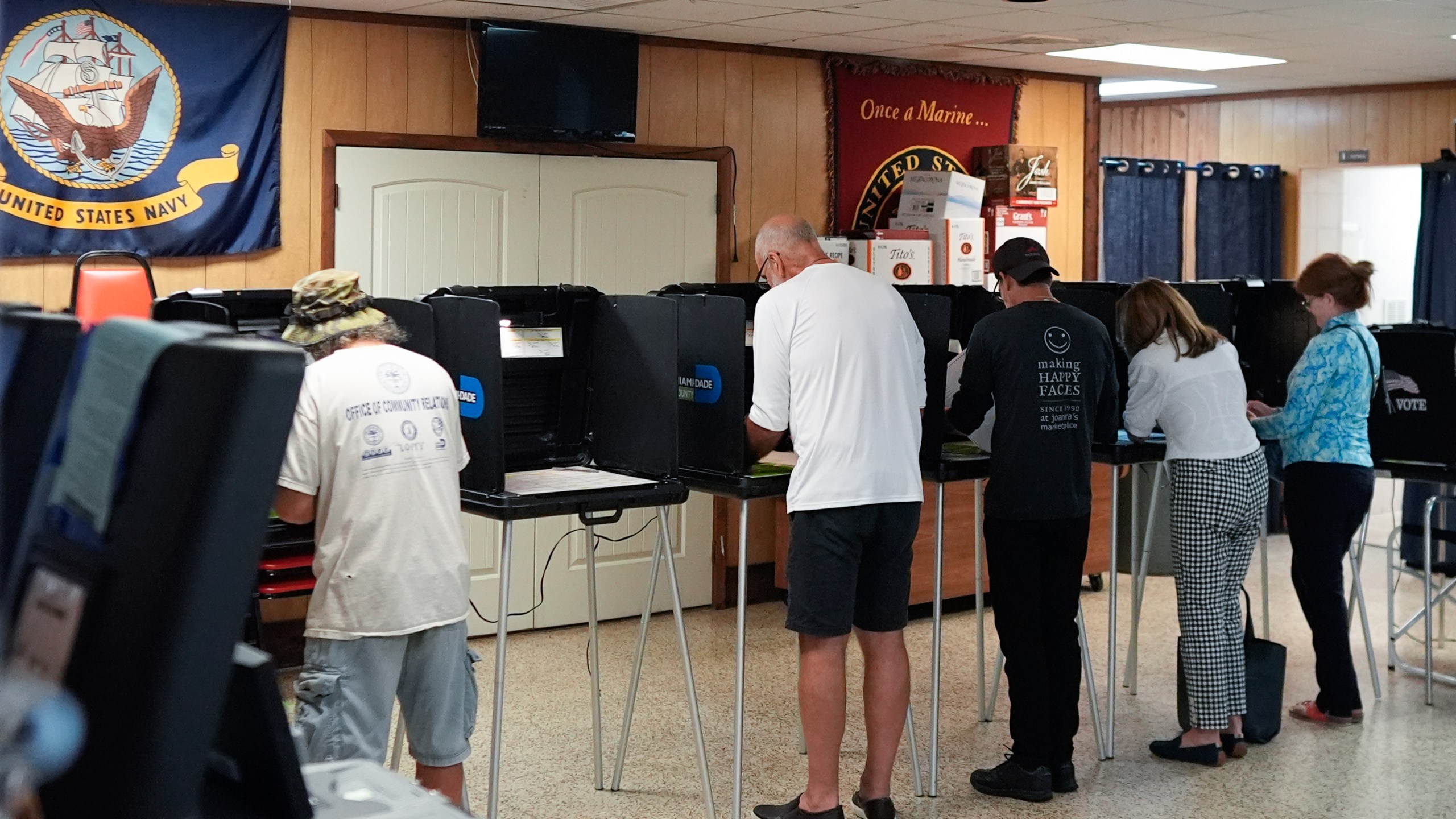 FILE - Voters fill in their ballots for Florida's primary election in South Miami, Fla., Aug. 20, 2024. (AP Photo/Rebecca Blackwell, File)