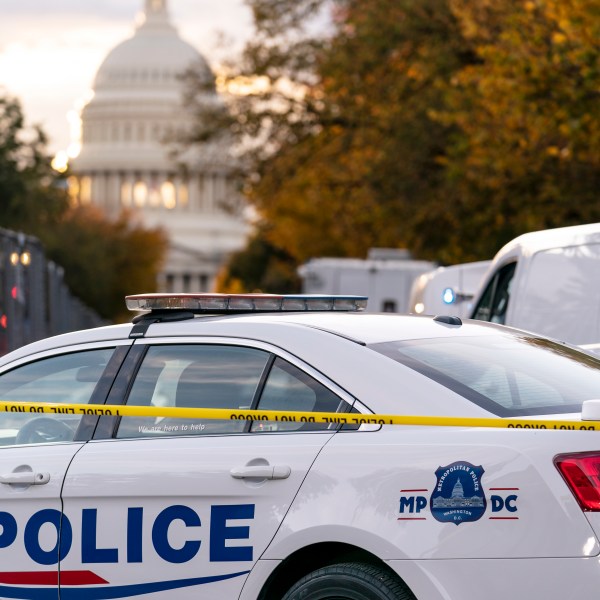 FILE - A Washington Metropolitan Police vehicle is seen near the Capitol, Oct. 19, 2022, in Washington. Police on Friday arrested a 15-year old boy on charges related to threats on social media that prompted an increased police presence at multiple schools in the nation's capital. The Instagram post showing a firearm and a list of D.C. schools prompted police to station officers at several different schools on Thursday. (AP Photo/J. Scott Applewhite, File)