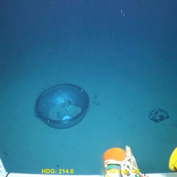 This June 2023 United States Coast Guard still frame from video provided by Pelagic Research Services, shows remains of the Titan submersible, center, on the floor of the Atlantic Ocean. (U.S. Coast Guard Video courtesy Pelagic Research Services via AP)