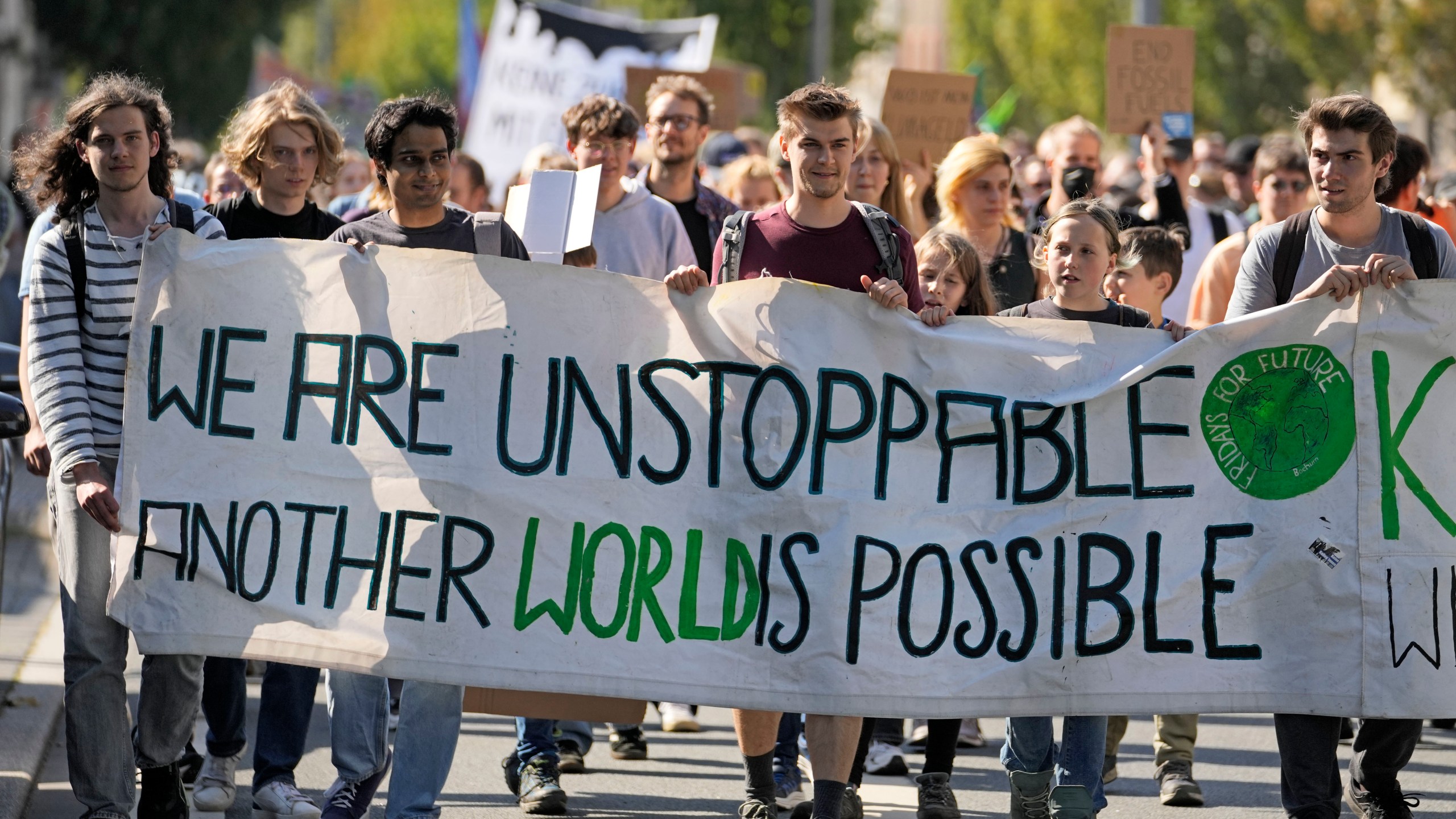 People demonstrate in the City of Bochum, western Germany, as they take part in a Global Climate Strike protest of the Fridays For Future movement on Friday, Sept. 20, 2024. (AP Photo/Martin Meissner)