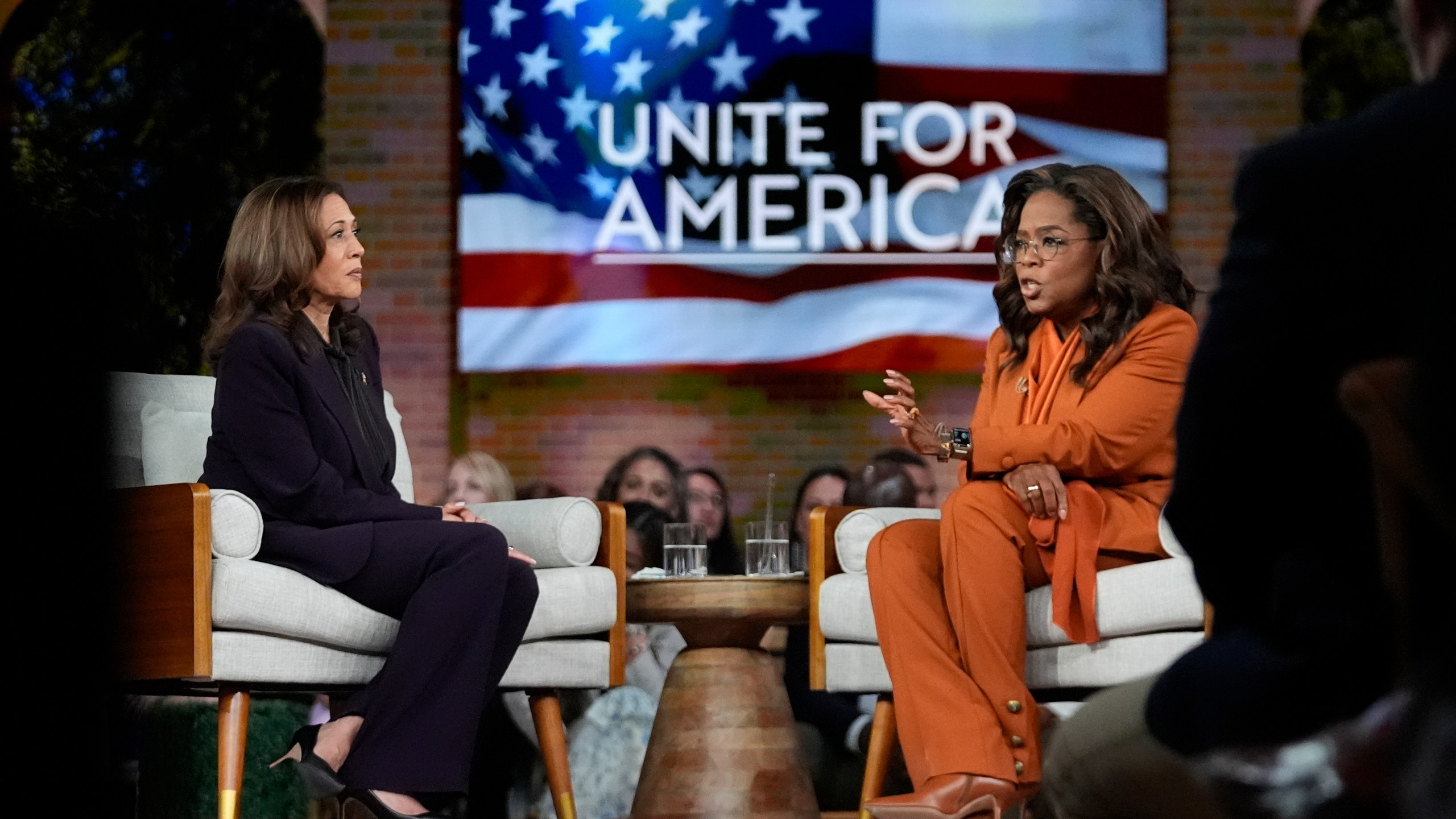 Democratic presidential nominee Vice President Kamala Harris joins Oprah Winfrey at Oprah's Unite for America Live Streaming event Thursday, Sept. 19, 2024 in Farmington Hills, Mich. (AP Photo/Paul Sancya)