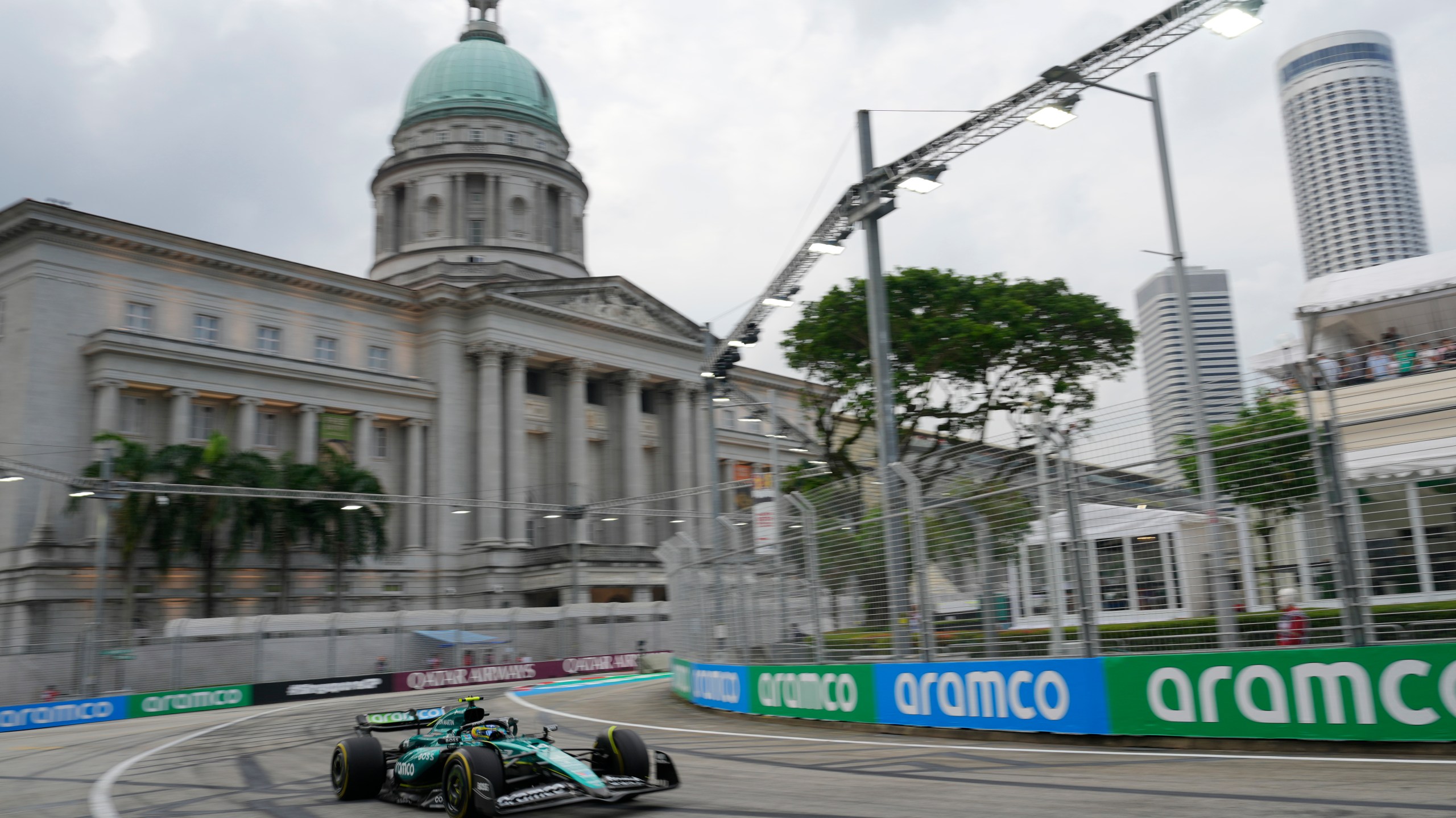 Aston Martin driver Fernando Alonso of Spain steers his car during the third practice session of the Singapore Formula One Grand Prix at the Marina Bay Street Circuit, in Singapore, Saturday, Sept. 21, 2024. (AP Photo/Vincent Thian)